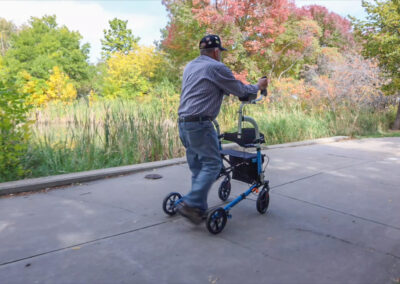 Man using A Better Walker outside